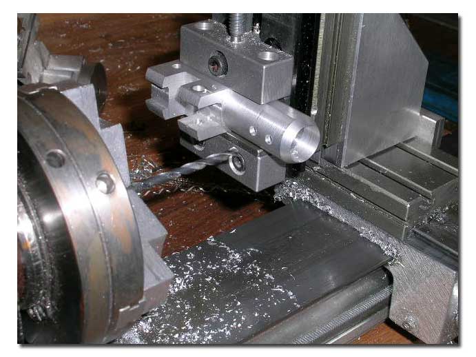 Drilling (then tapping) for set screws for insert.